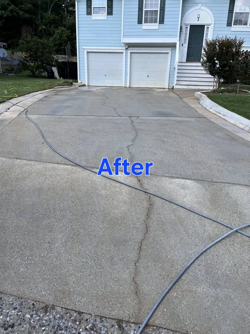 Clean driveway in front of a two-car garage