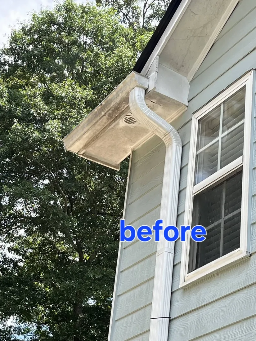 Same soffit and gutter before cleaning, stained